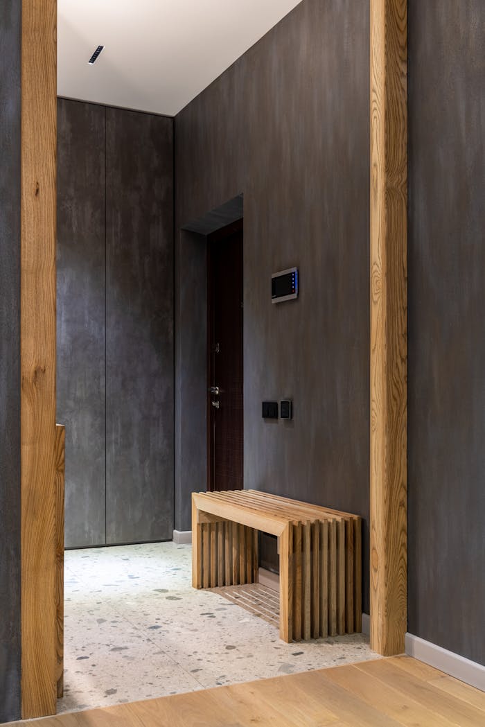 Sleek hallway with wooden accents showcasing modern interior design.